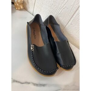 Venus Celia black leather moc toe loafers.